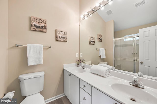 11431 Heritage Commons Way, Reston, VA 20194 - full bath featuring toilet, double vanity, a stall shower, and baseboards