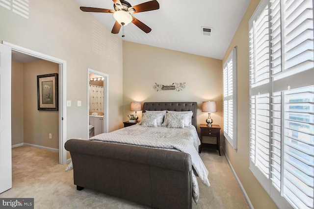 11431 Heritage Commons Way, Reston, VA 20194 - bedroom with light colored carpet, multiple windows, high vaulted ceiling, baseboards, and a ceiling fan