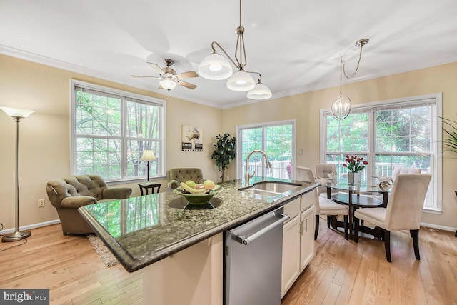 11431 Heritage Commons Way, Reston, VA 20194 - kitchen featuring dishwasher, a sink, light wood finished floors, dark stone counters, and white cabinets