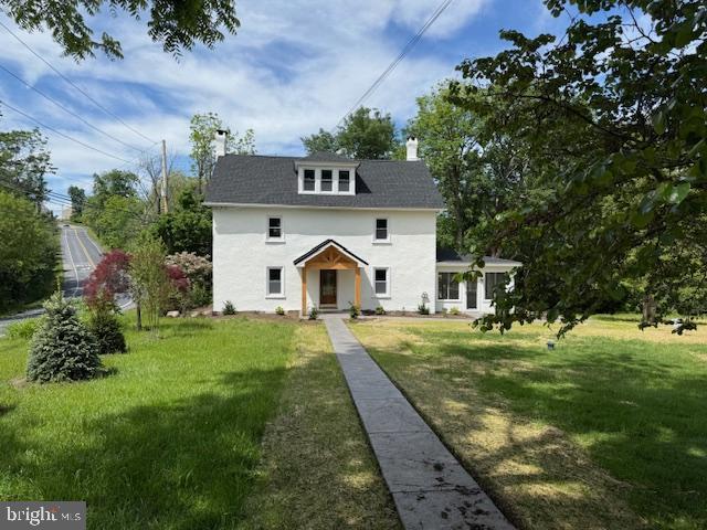 639 Old Airport Rd, Douglassville, PA 19518 - view of front facade with a chimney and a front yard