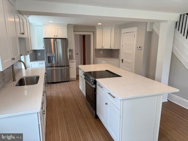 639 Old Airport Rd, Douglassville, PA 19518 - kitchen featuring stainless steel fridge, black / electric stove, a sink, decorative backsplash, and recessed lighting
