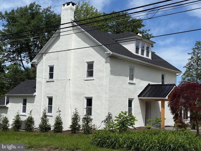 639 Old Airport Rd, Douglassville, PA 19518 - view of side of home featuring a chimney and stucco siding