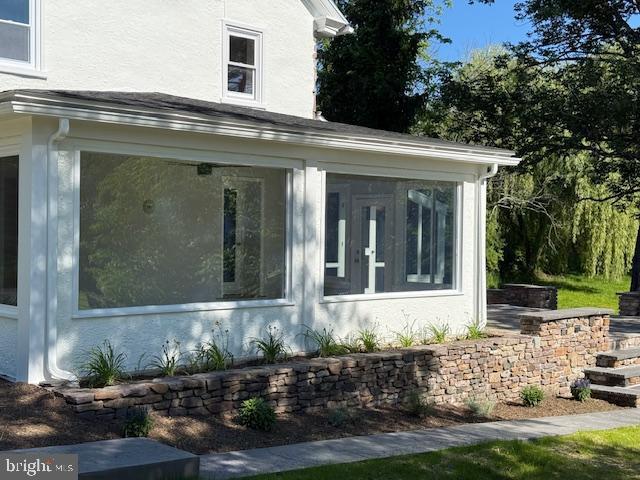639 Old Airport Rd, Douglassville, PA 19518 - view of side of home with a sunroom and stucco siding