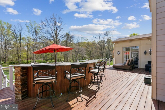 deck featuring outdoor dry bar