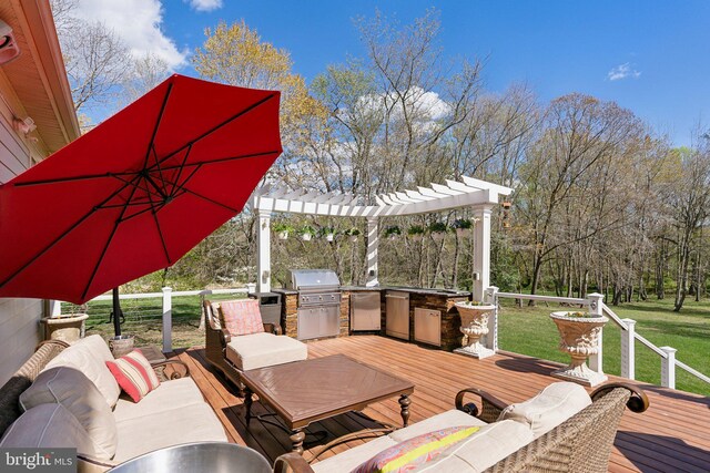 deck featuring area for grilling, a pergola, a yard, and outdoor lounge area