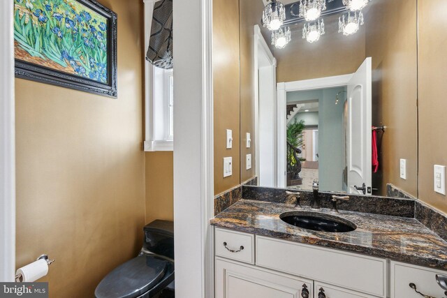 bathroom featuring a wealth of natural light and vanity