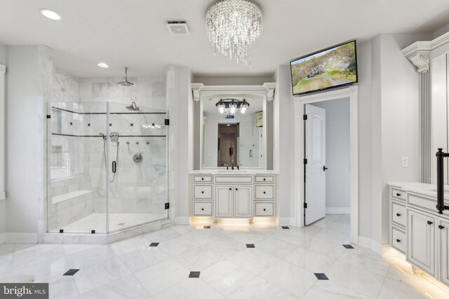 full bathroom featuring visible vents, a stall shower, vanity, baseboards, and a chandelier