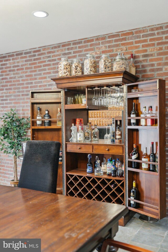 bar featuring brick wall