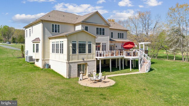 back of house with board and batten siding, a lawn, a wooden deck, and stairs