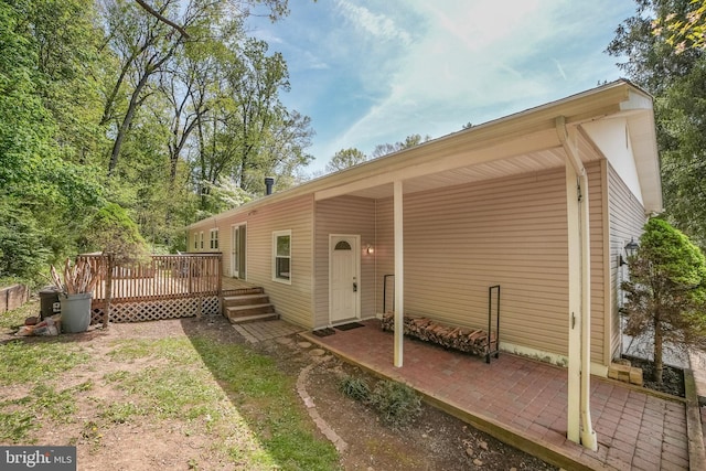 back of property with a deck
