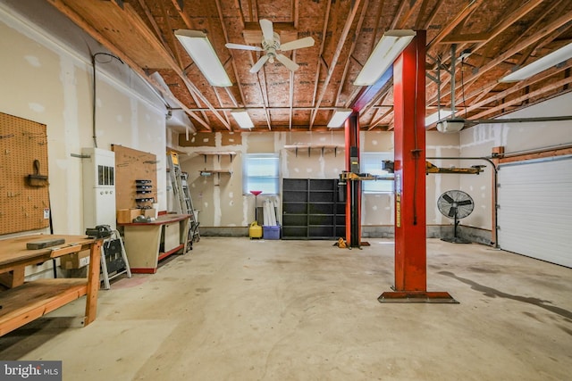 basement featuring a workshop area and ceiling fan