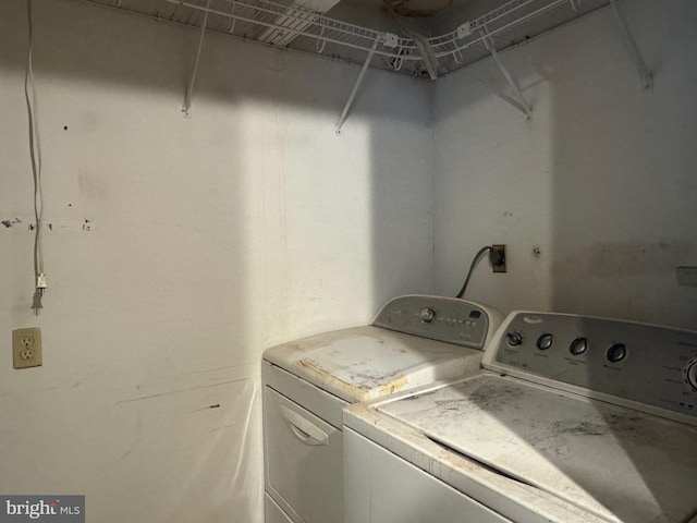 clothes washing area with laundry area and washing machine and clothes dryer