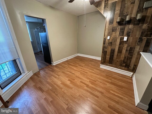 5934 Delancey St, Philadelphia, PA 19143 - spare room featuring ceiling fan, a textured ceiling, baseboards, and wood finished floors
