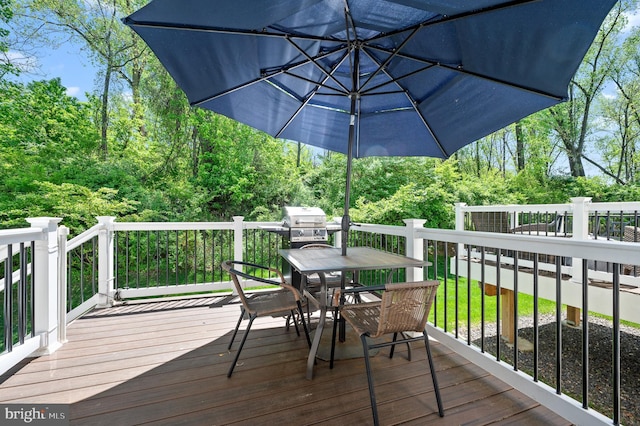 wooden deck with outdoor dining area