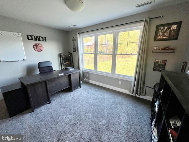 carpeted home office with baseboards and visible vents