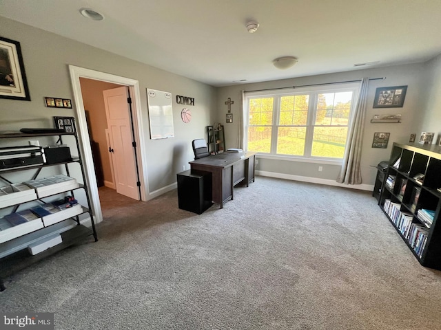 home office with carpet floors and baseboards