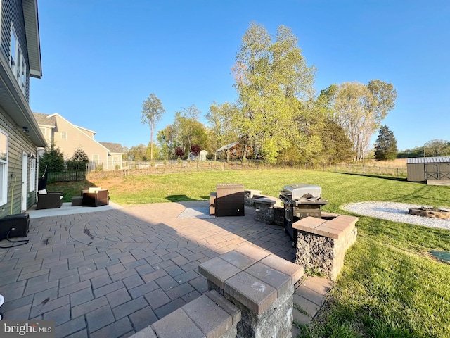 view of patio / terrace with a fenced backyard and an outdoor fire pit