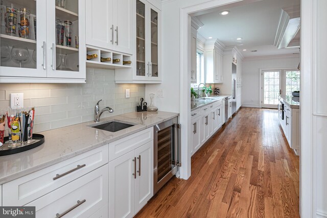 528 Prospect Ave, Princeton, NJ 08540 - kitchen featuring crown molding, a sink, beverage cooler, and white cabinets