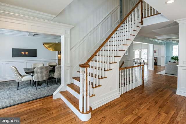 528 Prospect Ave, Princeton, NJ 08540 - stairway with a decorative wall, ornamental molding, decorative columns, and wood finished floors
