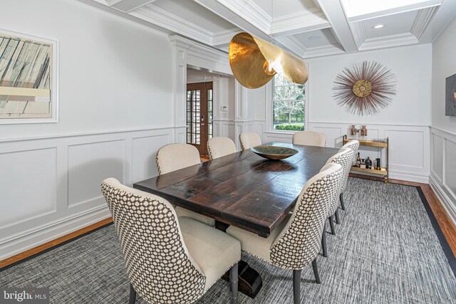 528 Prospect Ave, Princeton, NJ 08540 - dining space featuring dark wood-style floors, crown molding, beamed ceiling, coffered ceiling, and a decorative wall
