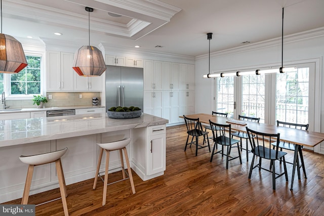 528 Prospect Ave, Princeton, NJ 08540 - kitchen with dark wood-style flooring, white cabinetry, crown molding, appliances with stainless steel finishes, and a sink