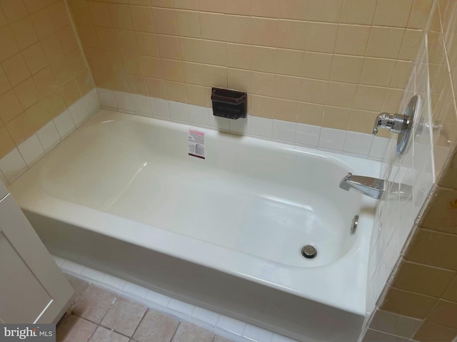 full bathroom with a shower, tile patterned floors, and a bath