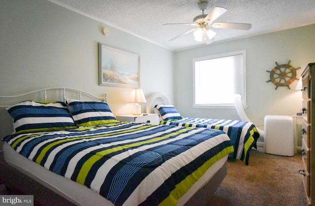 carpeted bedroom with a textured ceiling and ceiling fan