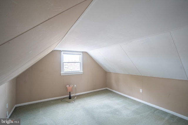 bonus room with carpet flooring, baseboards, and lofted ceiling