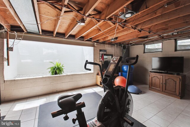 exercise area with light tile patterned floors