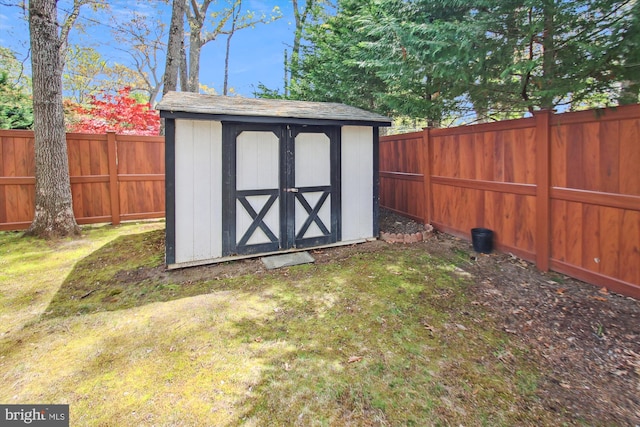 view of shed featuring a fenced backyard