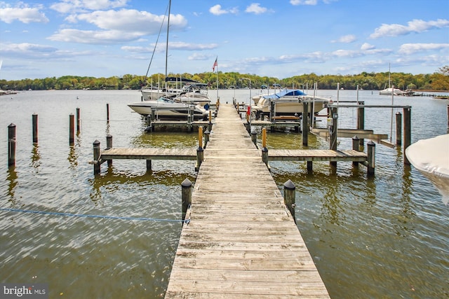 view of dock with a water view and boat lift