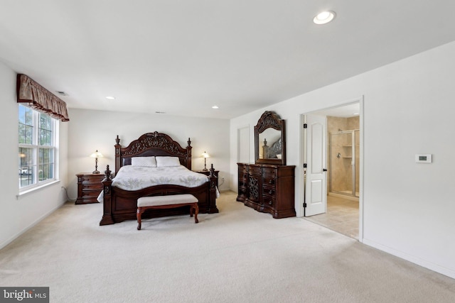 bedroom with visible vents, recessed lighting, connected bathroom, and light colored carpet