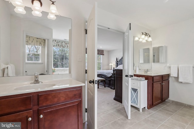 full bathroom featuring a wealth of natural light, ensuite bath, and a sink