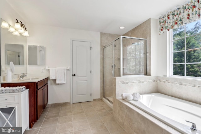 full bath featuring vanity, a shower stall, a bath, and tile patterned flooring