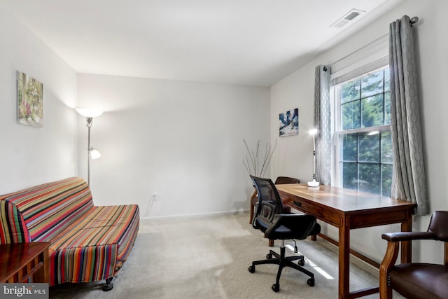 office area with visible vents, carpet floors, and baseboards