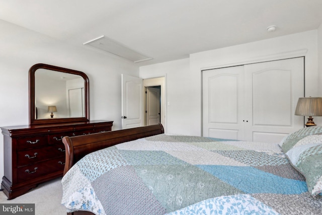 carpeted bedroom featuring a closet