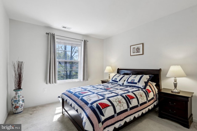 bedroom featuring visible vents, carpet floors, and baseboards
