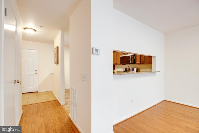 3502 Dartmoor Ln Unit 30, Olney, MD 20832 - hallway with light wood finished floors and baseboards