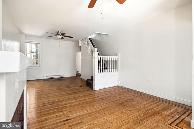 2333 E Huntingdon St, Philadelphia, PA 19125 - bonus room with a baseboard heating unit, ceiling fan, wood finished floors, and stairway
