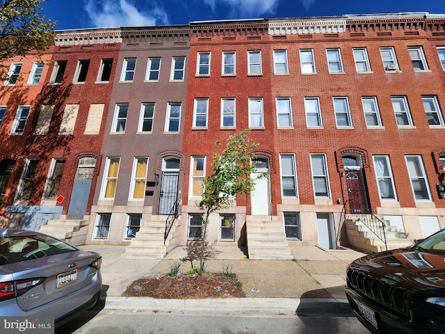 748 Dolphin St, Baltimore, MD 21217 - view of front of home with brick siding and entry steps