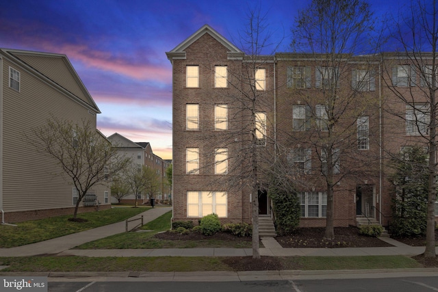 view of front of home with brick siding