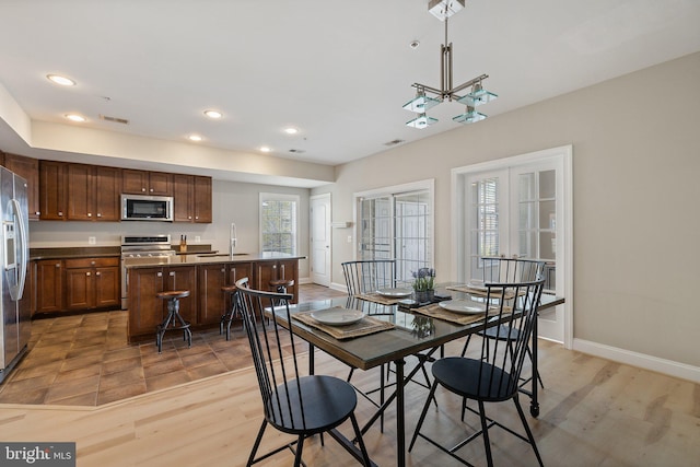 dining area with visible vents, recessed lighting, baseboards, and light wood-style floors