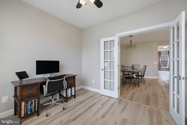 office area featuring baseboards, french doors, and wood finished floors