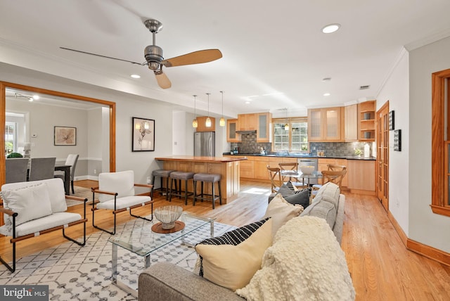 4206 Ingomar St NW, Washington, DC 20015 - living area featuring ornamental molding, light wood-style floors, baseboards, ceiling fan, and recessed lighting