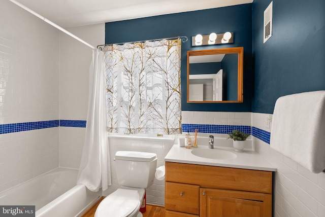 4206 Ingomar St NW, Washington, DC 20015 - full bath featuring vanity, toilet, shower / bath combo, and tile walls