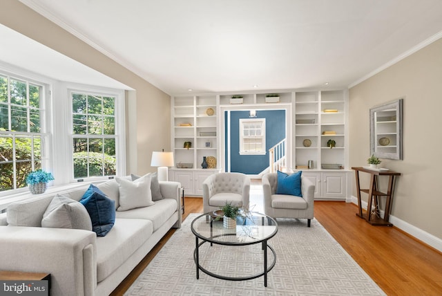 4206 Ingomar St NW, Washington, DC 20015 - living room with ornamental molding, wood finished floors, baseboards, built in shelves, and stairway