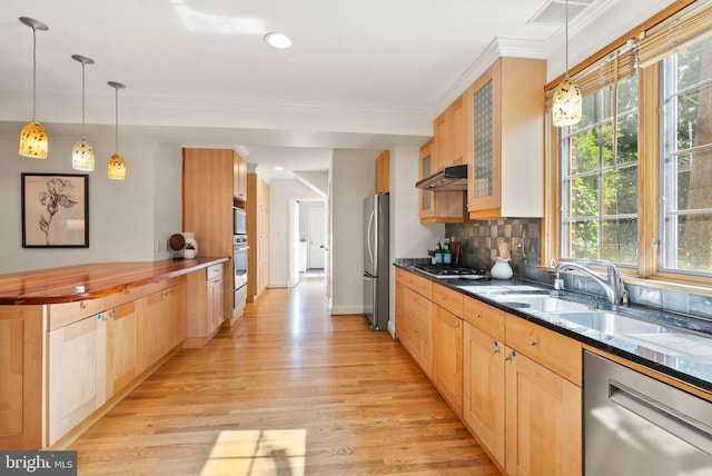 4206 Ingomar St NW, Washington, DC 20015 - kitchen with appliances with stainless steel finishes, light wood finished floors, glass insert cabinets, tasteful backsplash, and light brown cabinetry