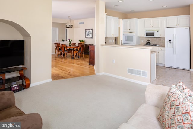 1432 Quaker Rdg, West Chester, PA 19380 - living room featuring recessed lighting, visible vents, light colored carpet, and baseboards
