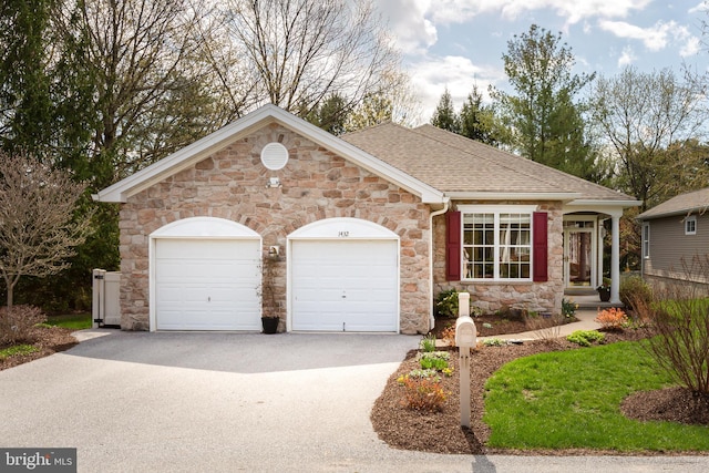 1432 Quaker Rdg, West Chester, PA 19380 - ranch-style home featuring concrete driveway, stone siding, an attached garage, and a shingled roof