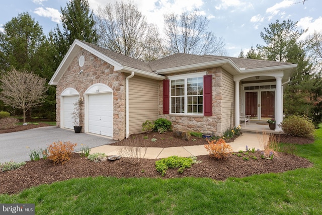1432 Quaker Rdg, West Chester, PA 19380 - single story home featuring aphalt driveway, a shingled roof, a garage, stone siding, and french doors